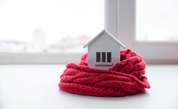 A model house wrapped in a scarf