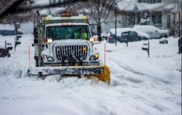 Snow plow in a blizzard